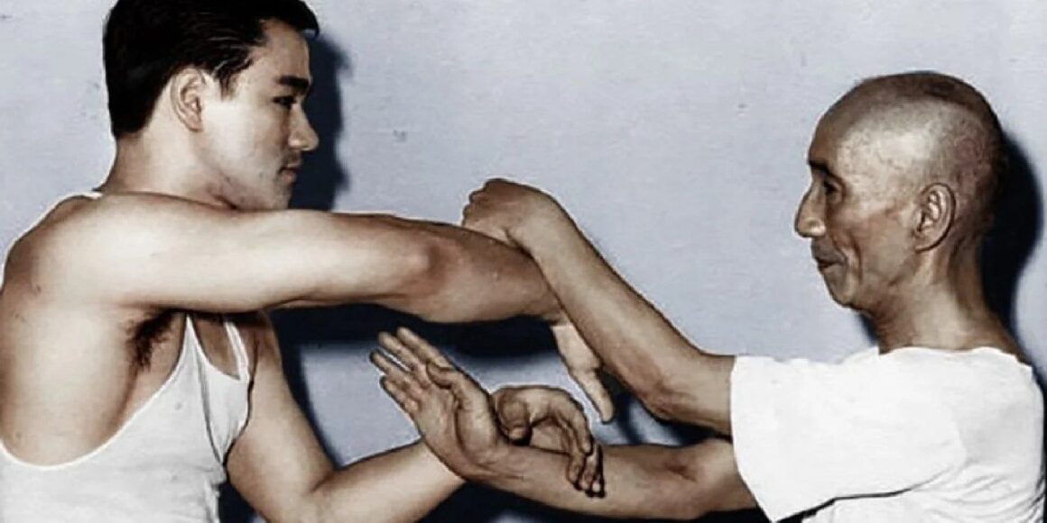 A man is demonstrating a unique martial art technique.