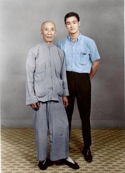Two men standing next to each other in an old photo - (Y)Ip Man's true identity.