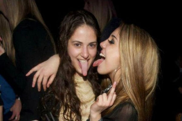 Two girls posing with their tongues out at a party. So The Girls Got A Bit Wild This Weekend (56 Pics)