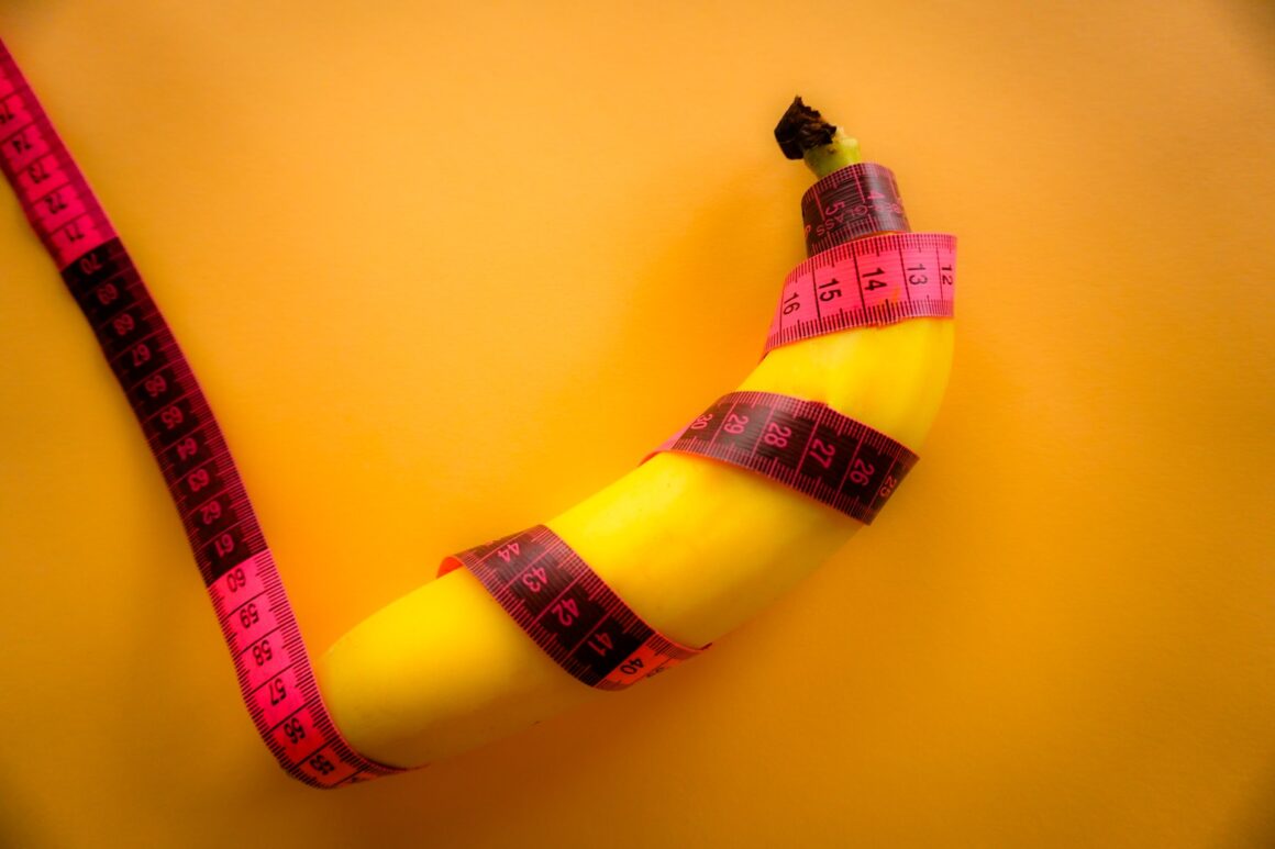 A banana wrapped in a measuring tape for accurate measurement.