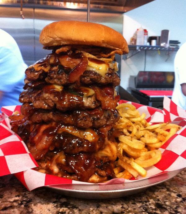 Warning: A stack of burgers and fries on a table that will make you crave!