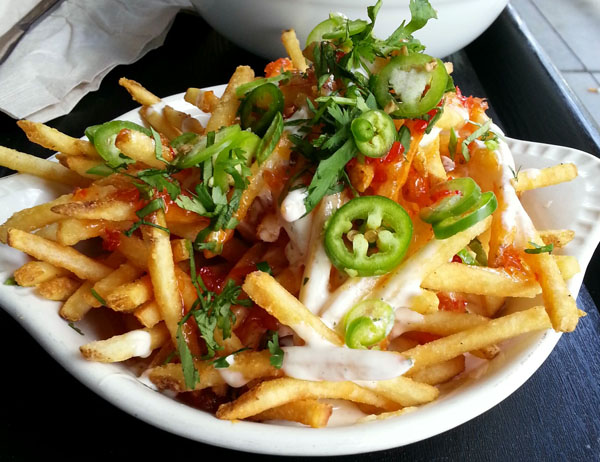 Warning: A bowl of french fries on a table, food porn ahead.
