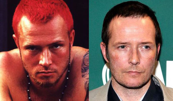 Two famous pop stars - one with no hair and the other with red hair - known for their iconic looks in the 90's.